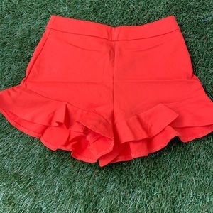 orange shorts by zara